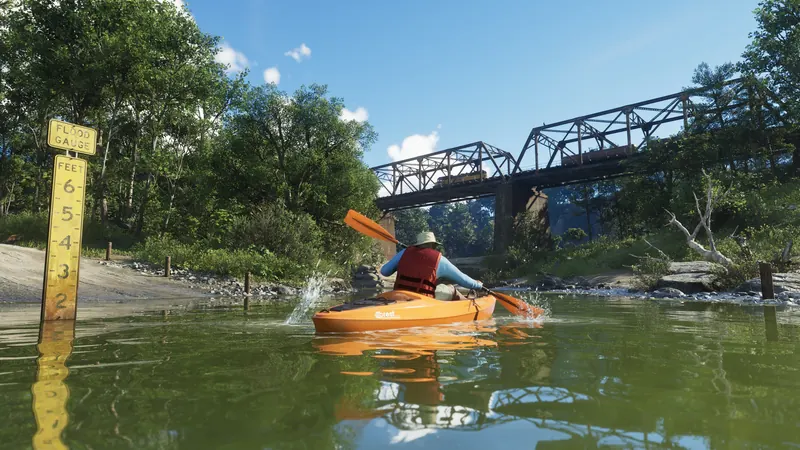 Kayaks on a river under a railway bridge in Mount Kalaga