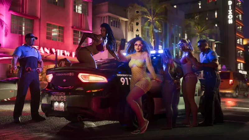 Vice City at night with neon hotel signs and Vice Beach Police